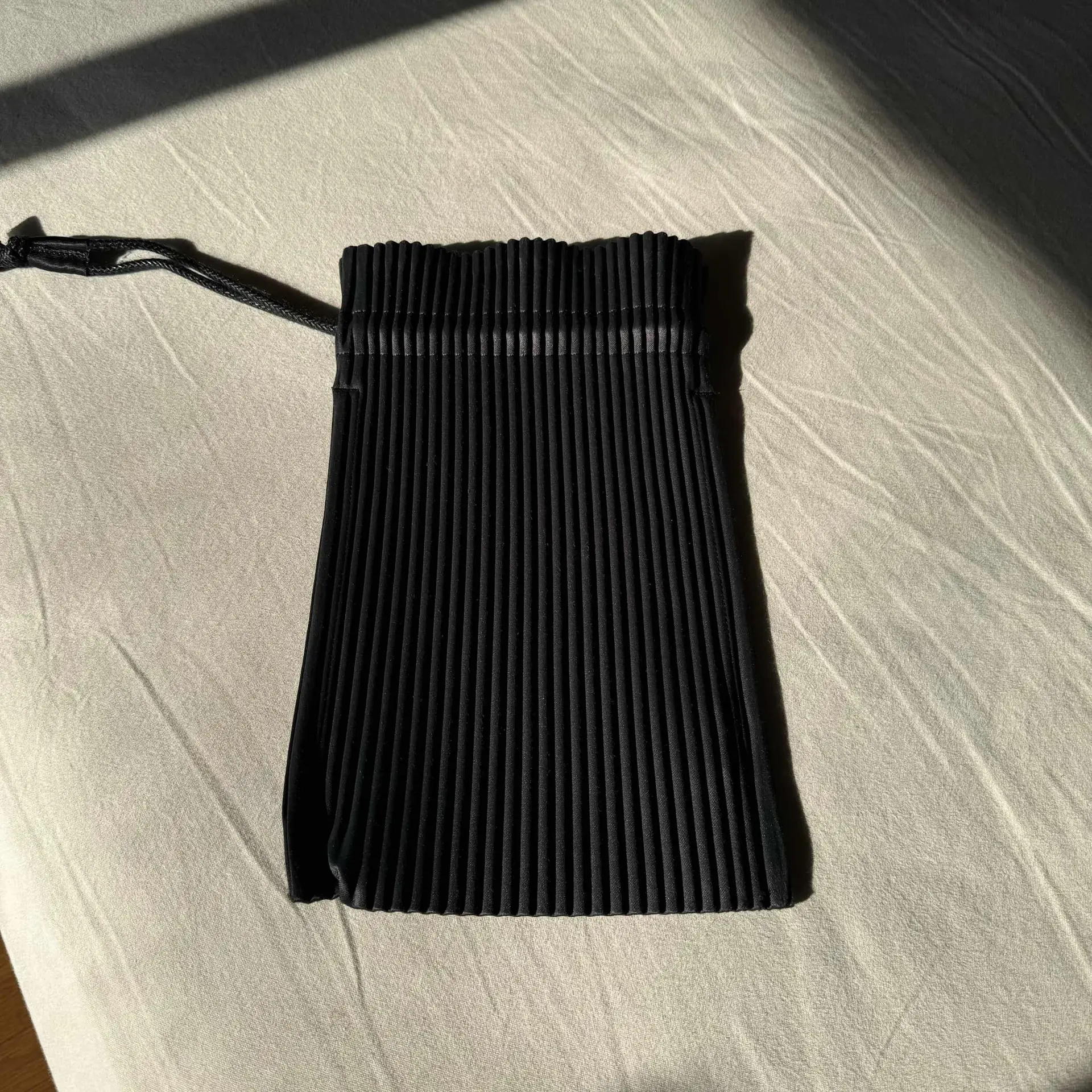 Homme Plisse Pleated drawstring bag